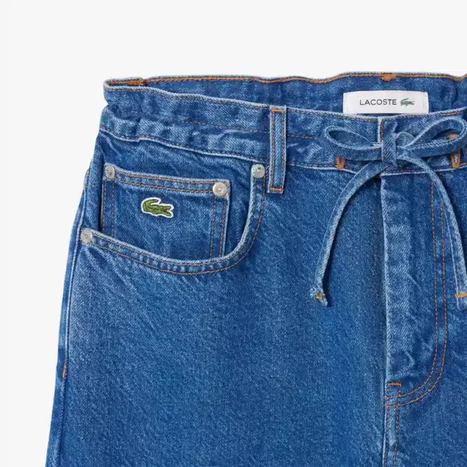 Dambyxor i denim med vid ben Dambyxor i denim med vid ben