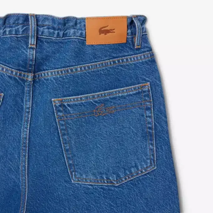 Dambyxor i denim med vid ben Dambyxor i denim med vid ben