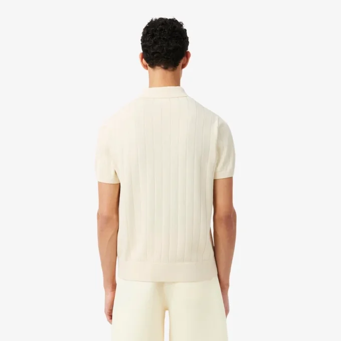Flytande ribbad stickad tröja med polokrage Flytande ribbad stickad tröja med polokrage