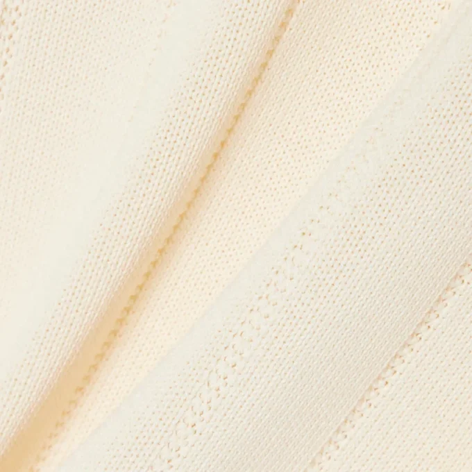 Flytande ribbad stickad tröja med polokrage Flytande ribbad stickad tröja med polokrage