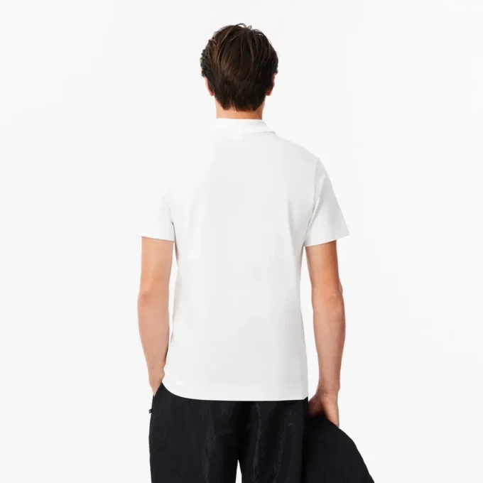 Herrpikétröja i normal passform med Lacoste Movement-tryck Herrpikétröja i normal passform med Lacoste Movement-tryck