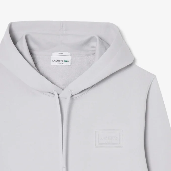 Huvtröja med präglad logotyp