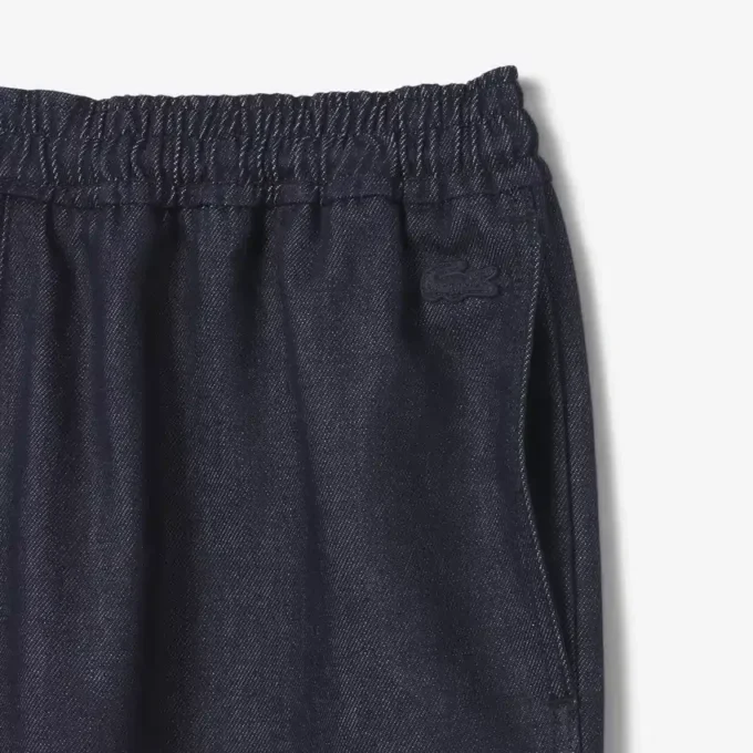 Joggingbyxor i denim från catwalken Joggingbyxor i denim från catwalken