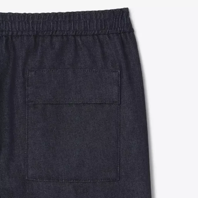 Joggingbyxor i denim från catwalken Joggingbyxor i denim från catwalken