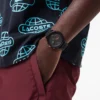 Lacoste.12.12 Chrono-klocka i svart och neje-guld, silikon Lacoste.12.12 Chrono-klocka i svart och neje-guld, silikon