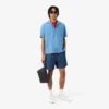 Lacoste Club-clutch i kornigt läder