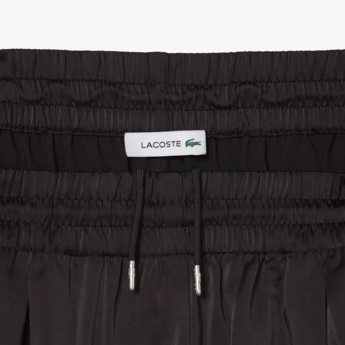 Oversized-byxor i satin med resår Oversized-byxor i satin med resår
