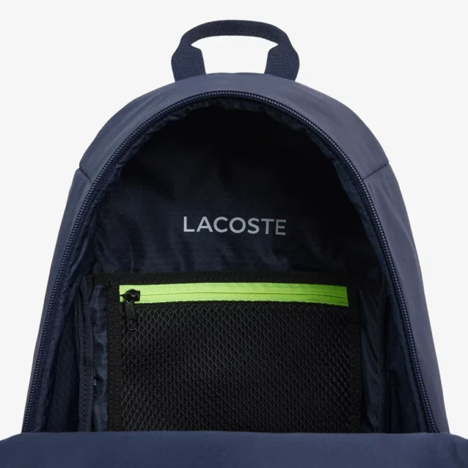 Play in Lacoste-ryggsäck