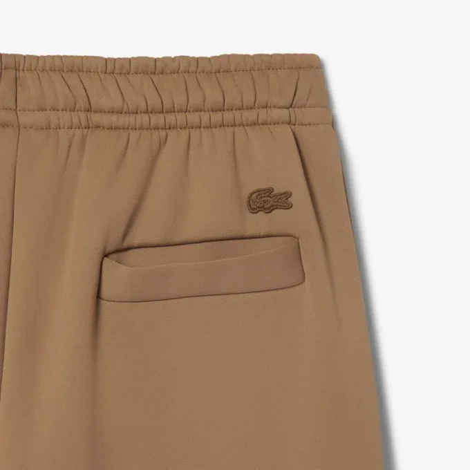 Runway-joggingbyxor i plisserad satin Runway-joggingbyxor i plisserad satin