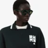 Runway-pikétröja med krage och badge-detalj