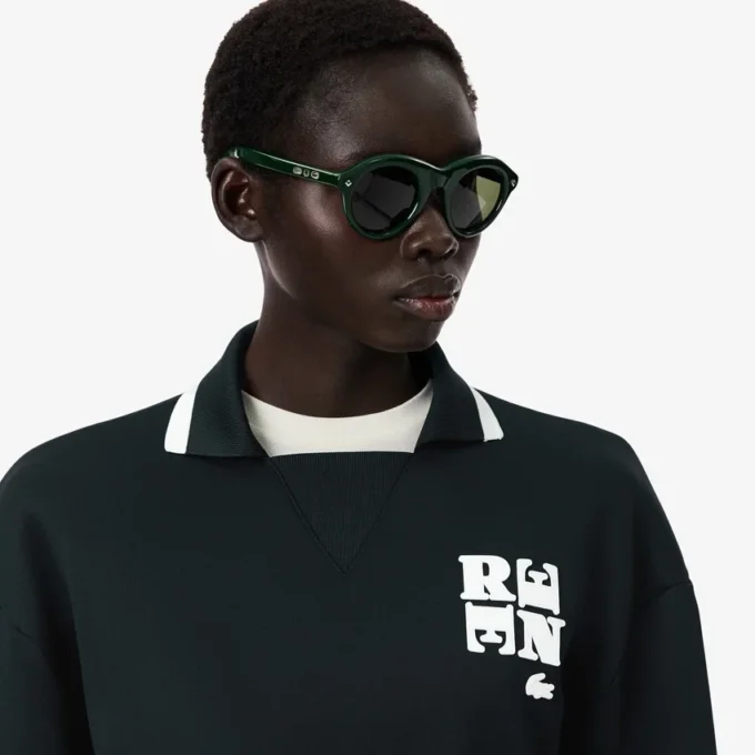 Runway-pikétröja med krage och badge-detalj