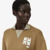 Runway-pikétröja med krage och badge-detalj