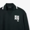 Runway-pikétröja med krage och badge-detalj