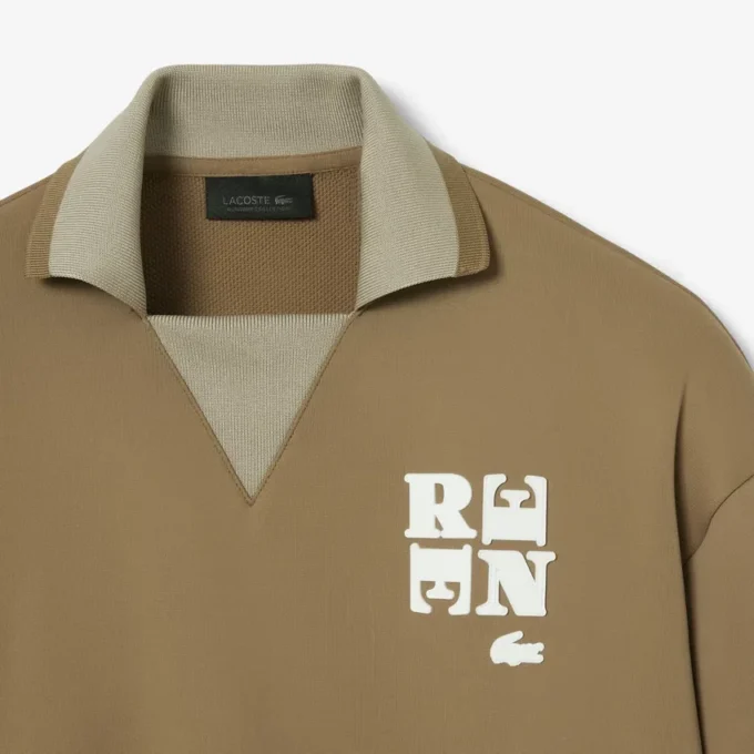 Runway-pikétröja med krage och badge-detalj