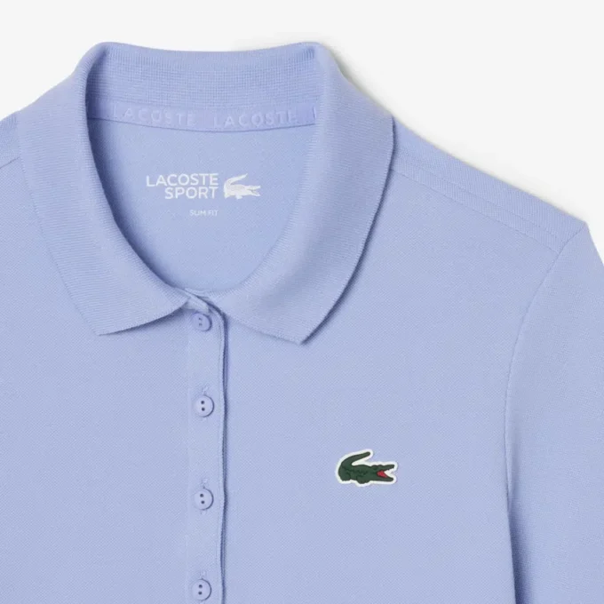 Slim fit-pikétröja för damer med värmereglerande egenskaper Slim fit-pikétröja för damer med värmereglerande egenskaper