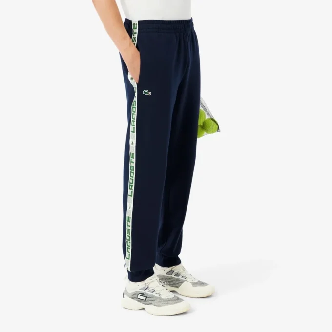 Tennis-träningsoveraller med logotyp och ränder för herr Tennis-träningsoveraller med logotyp och ränder för herr