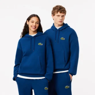 Unisex-hoodie med lös passform och badge-detalj