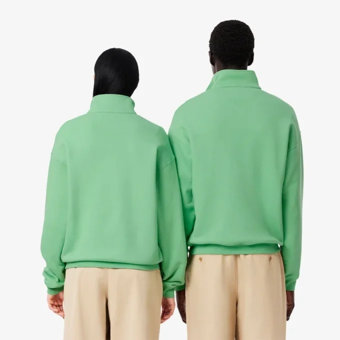 Unisex-tröja med halv dragkedja, lös passform och badge-detalj Unisex-tröja med halv dragkedja, lös passform och badge-detalj